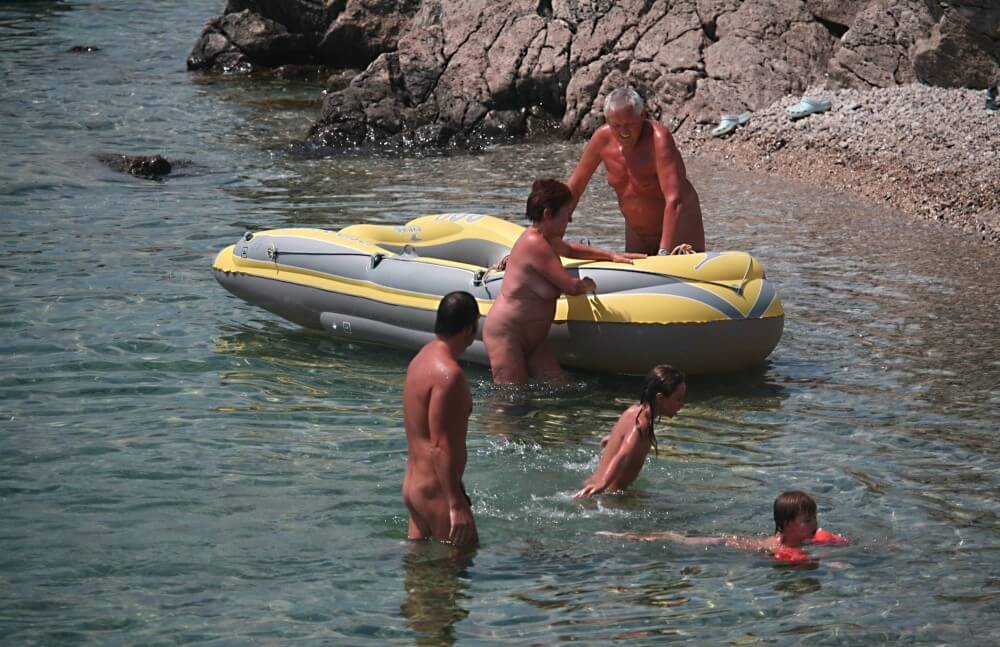 [NWoDL] Lone Nudist in Yellow Boat photos